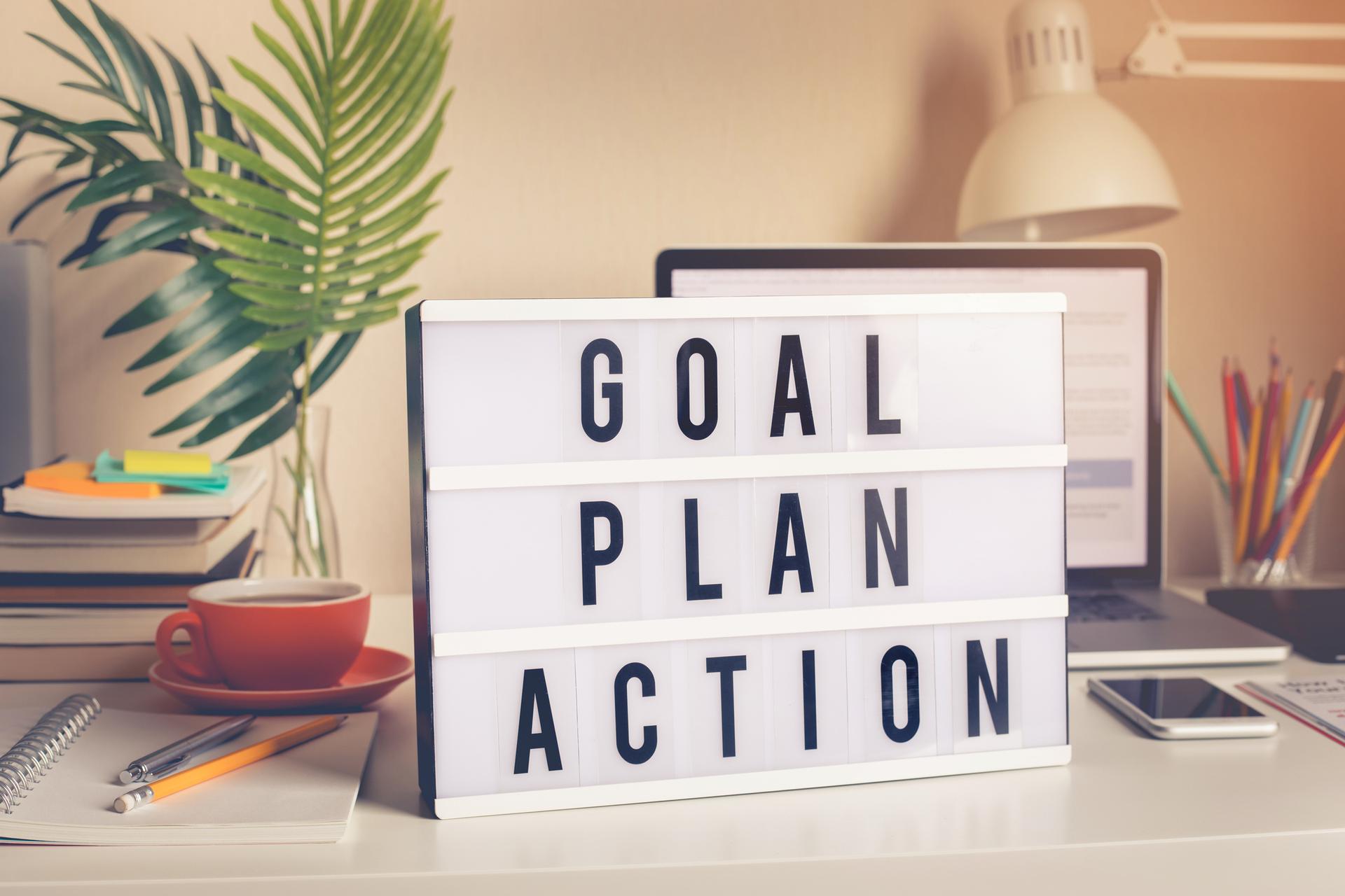 Desktop Scene With Sign Saying Goal Plan Action Image